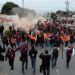Encabeza rector caravana naranja en apoyo al Correcaminos